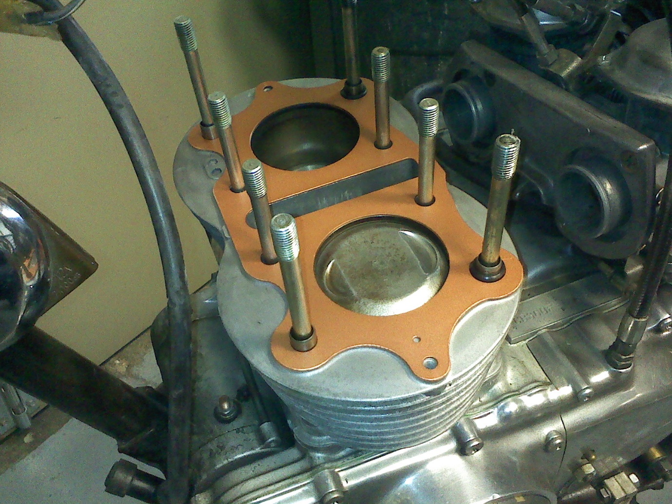 Copper gasket fitted to an engine barrel during assembly